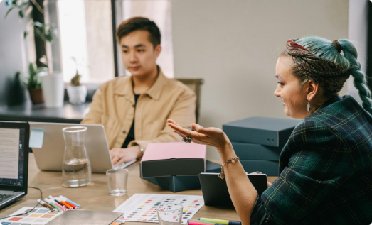 Team collaborating in an office setting, representing authenticity in teamwork