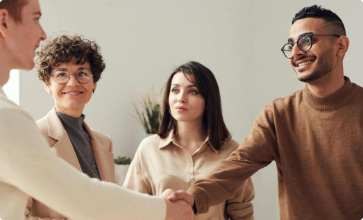 Team collaborating in an office setting, representing authenticity in teamwork